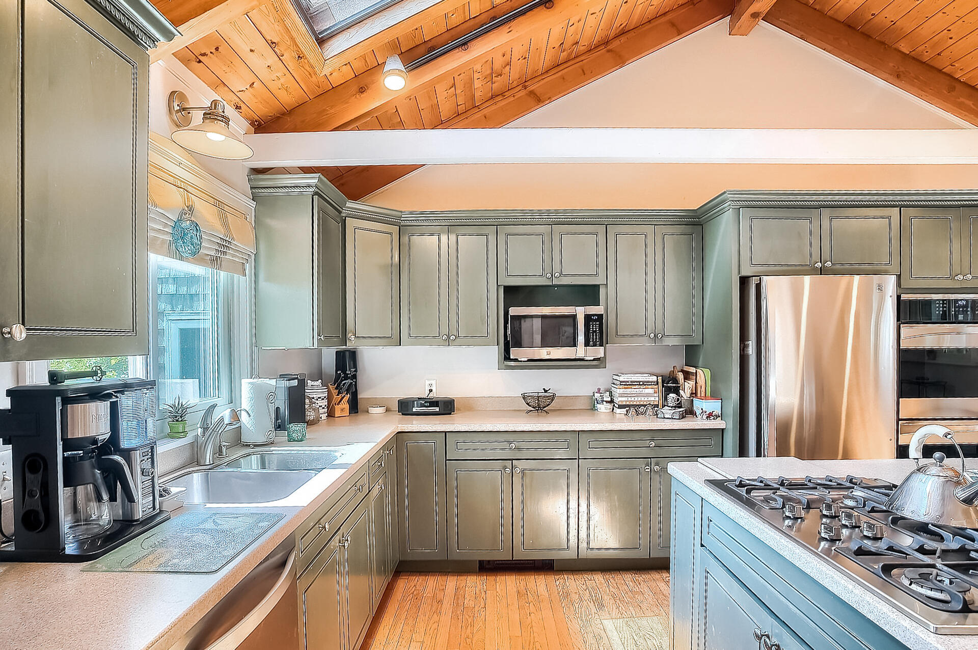 178 Main Street Orleans, MA 02653 - Photo 12 of 34 a kitchen with stainless steel appliances granite countertop a sink stove and refrigerator