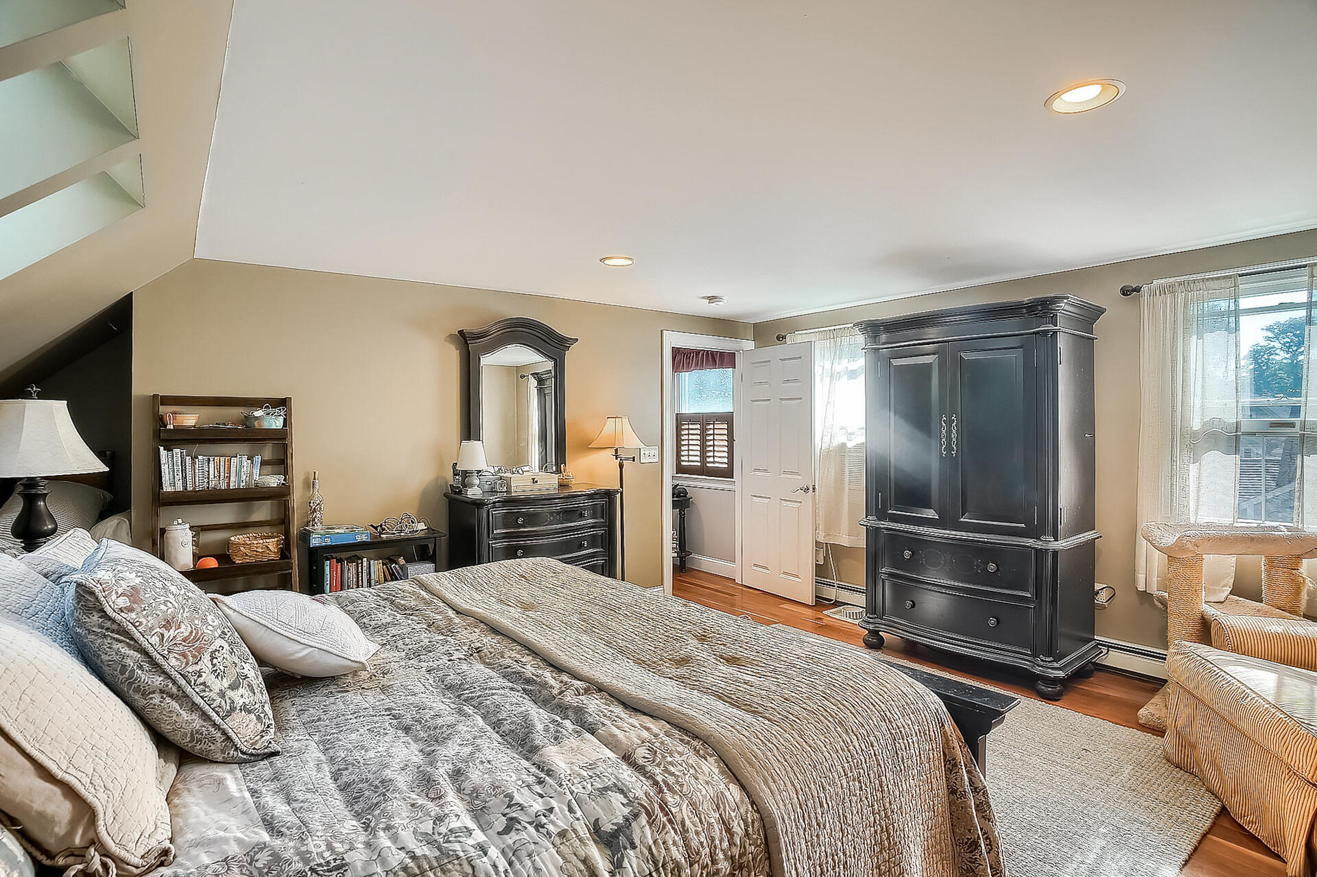 178 Main Street Orleans, MA 02653 - Photo 16 of 34 a bedroom with a bed and wooden floor