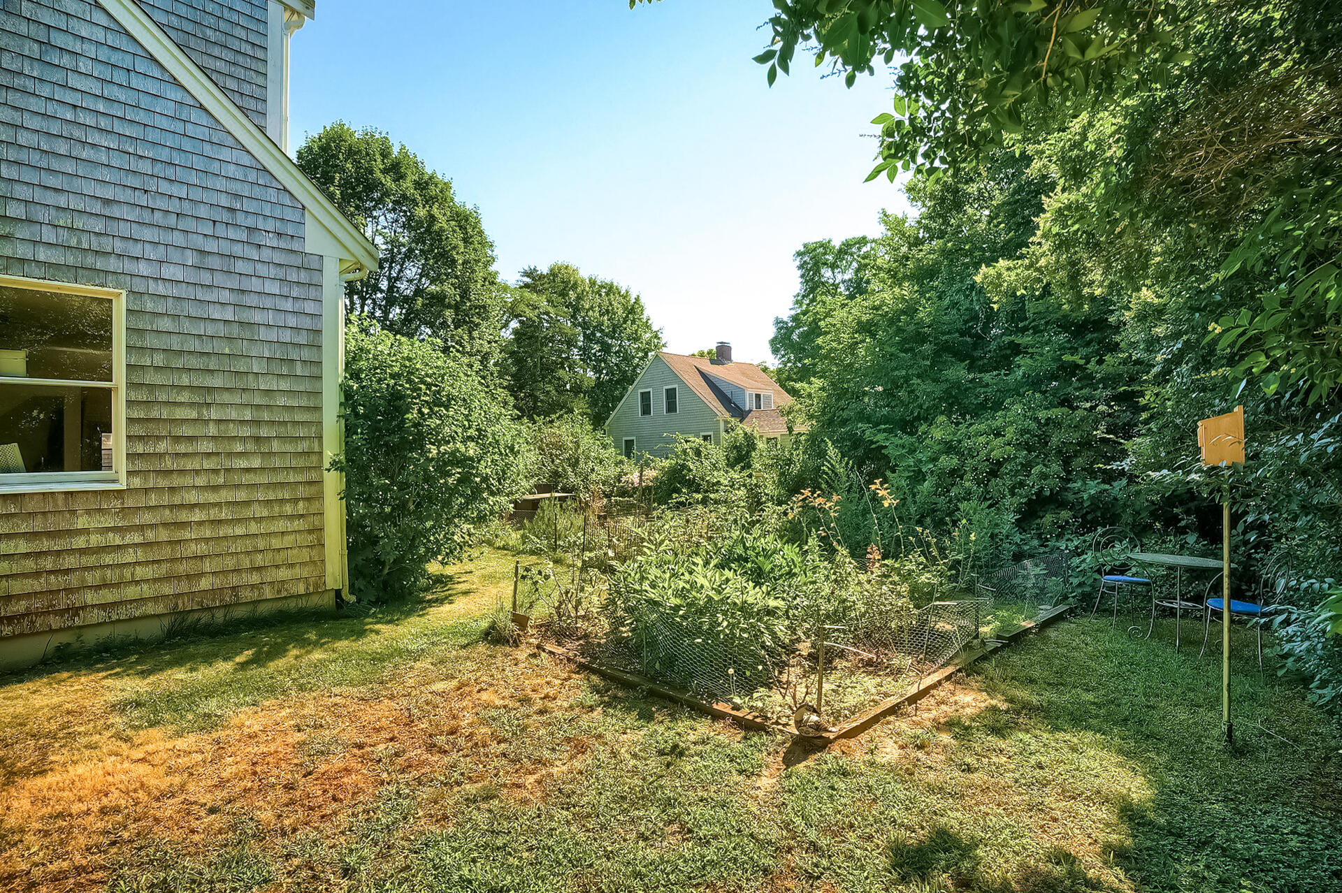 178 Main Street Orleans, MA 02653 - Photo 28 of 34 a backyard of a house with lots of green space