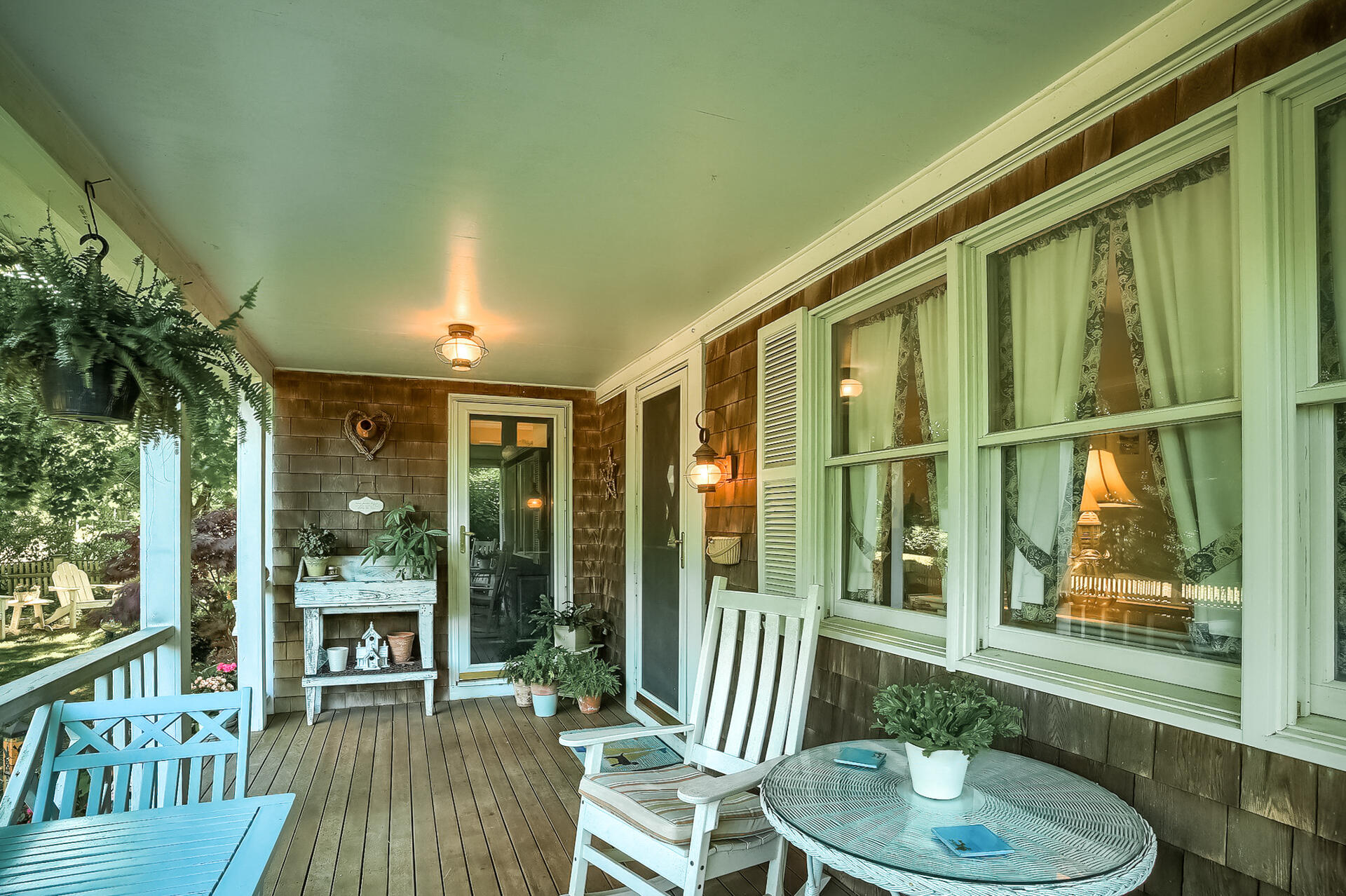 178 Main Street Orleans, MA 02653 - Photo 3 of 34 a porch with a table and chairs