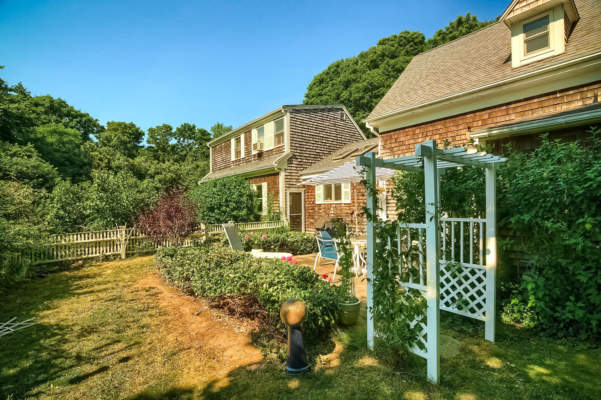 178 Main Street Orleans, MA 02653 - Photo 31 of 34 a view of a house with backyard and sitting area