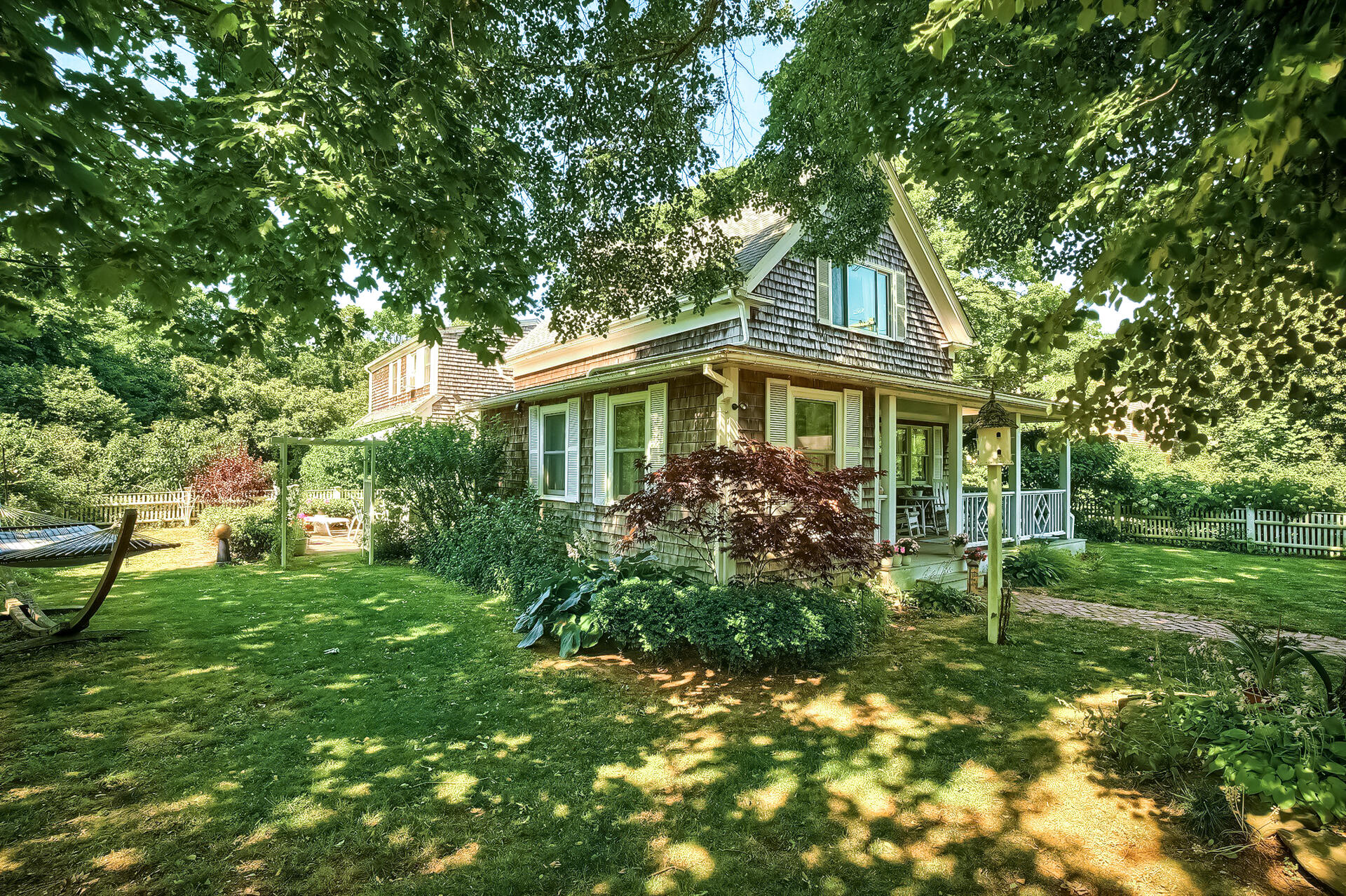 178 Main Street Orleans, MA 02653 - Photo 5 of 34 a house view with a garden space
