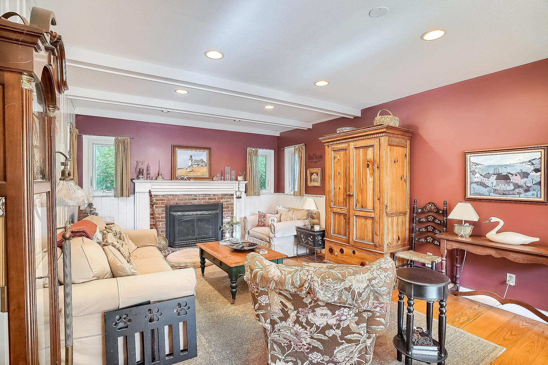 178 Main Street Orleans, MA 02653 - Photo 7 of 34 a living room with furniture a fireplace and a table