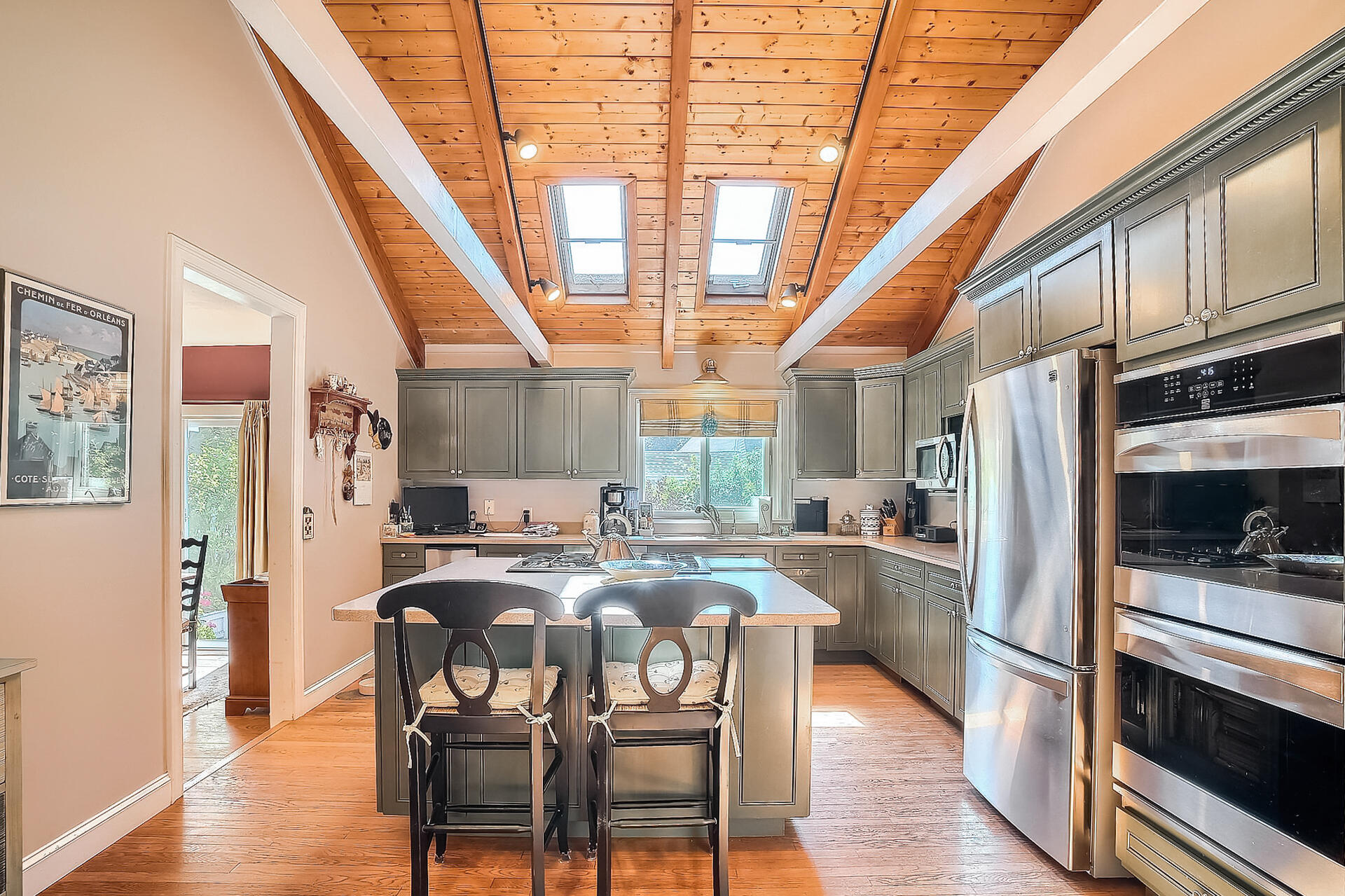 178 Main Street Orleans, MA 02653 - Photo 9 of 34 a kitchen with refrigerator a stove and chairs