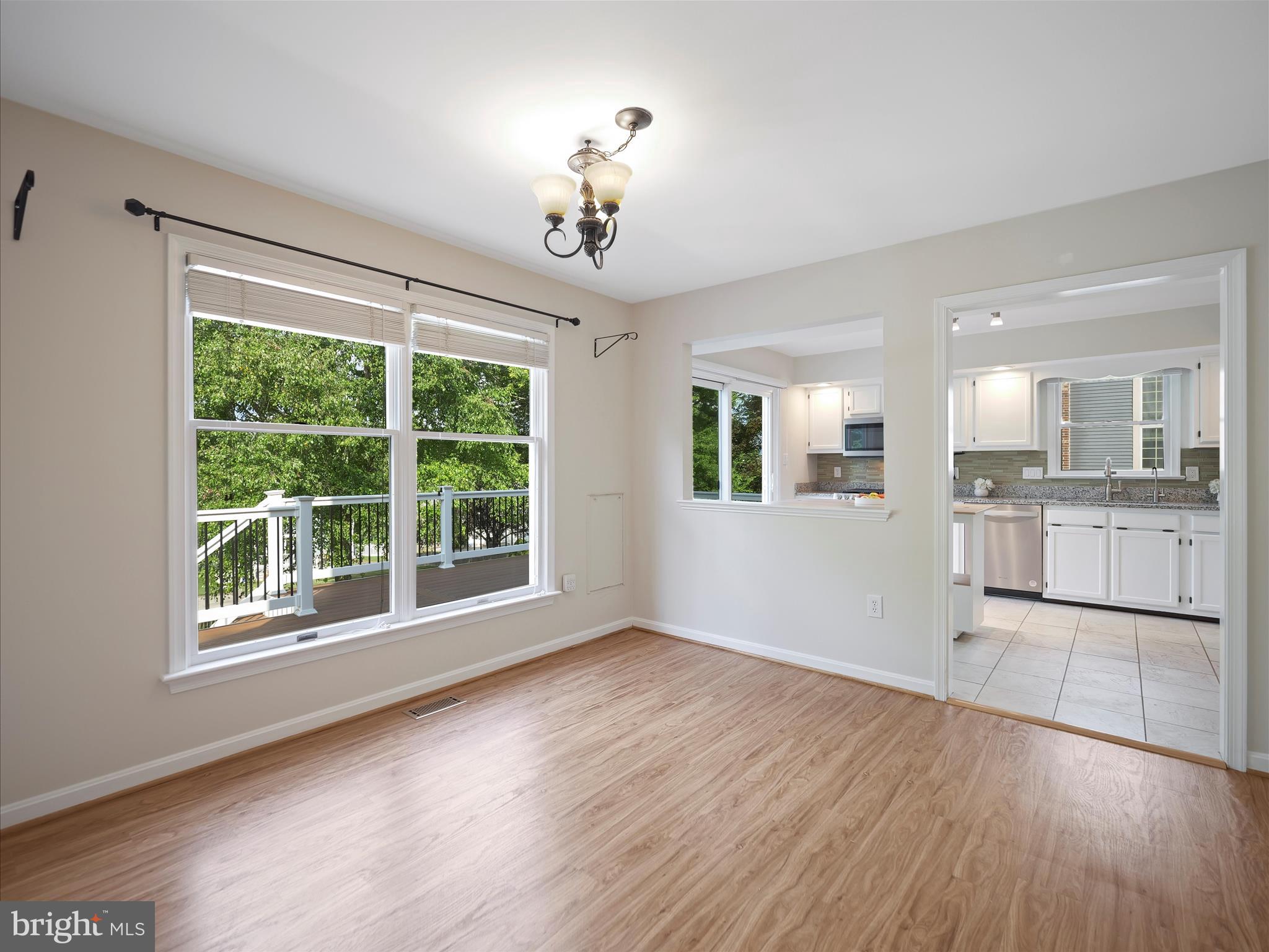 4614 Newington Road Jefferson, MD 21755 - Photo 11 of 35 a view of an empty room with wooden floor and a window