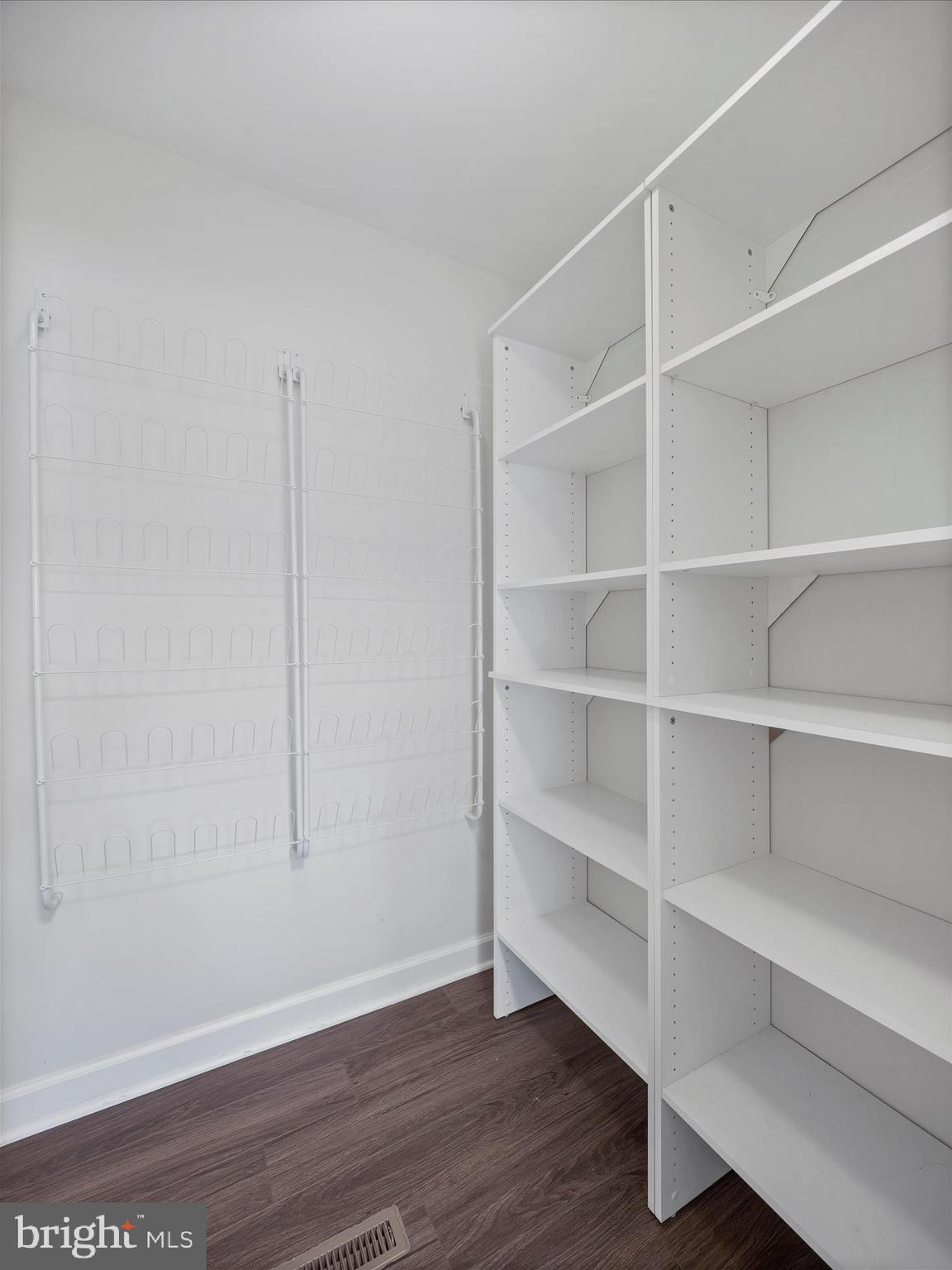 4614 Newington Road Jefferson, MD 21755 - Photo 16 of 35 a view of an empty room with a window and wooden floor