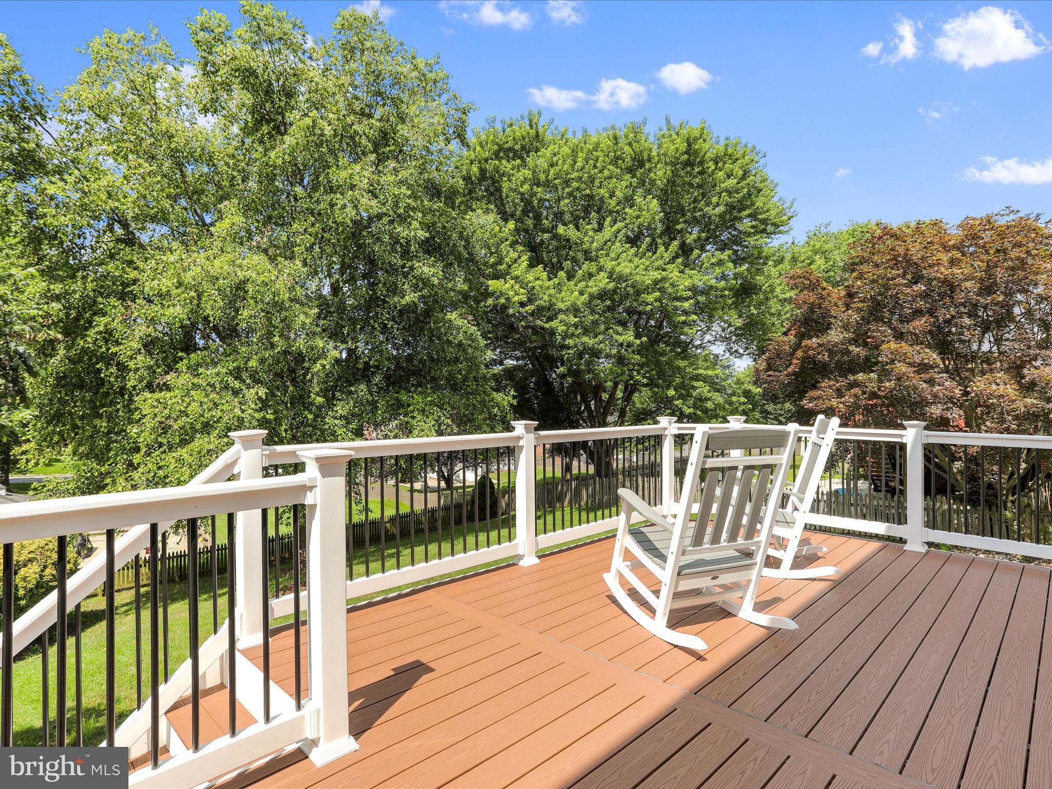 4614 Newington Road Jefferson, MD 21755 - Photo 25 of 35 a view of a balcony with two chairs and wooden floor