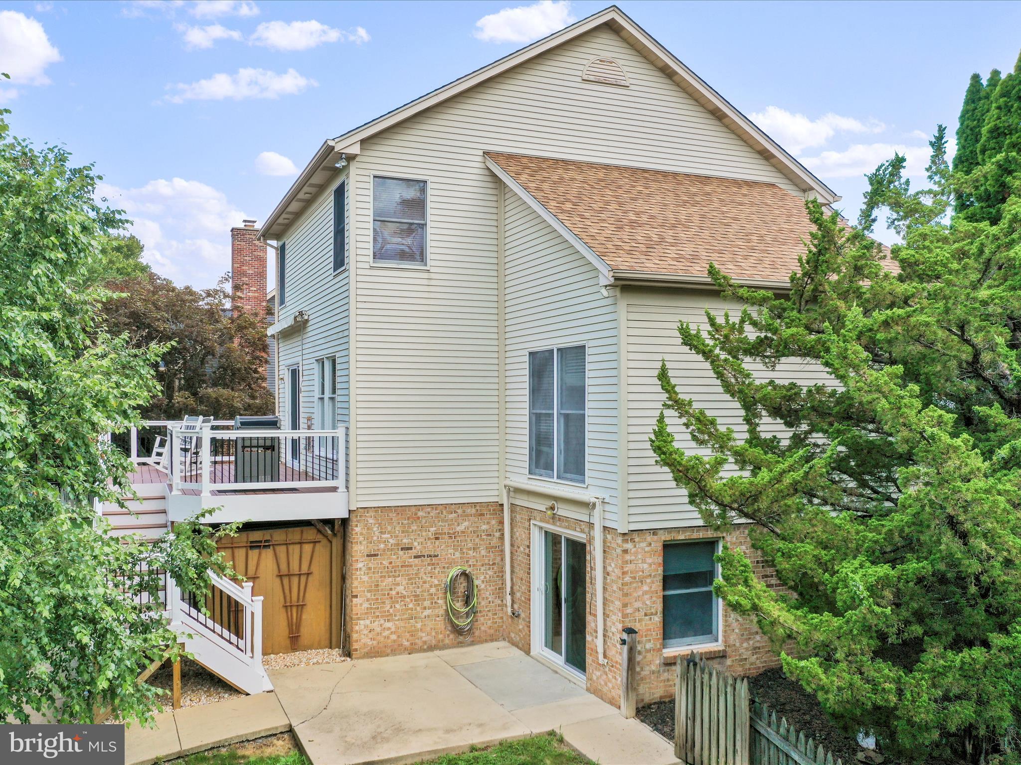 4614 Newington Road Jefferson, MD 21755 - Photo 27 of 35 a front view of a house with a garden and plants