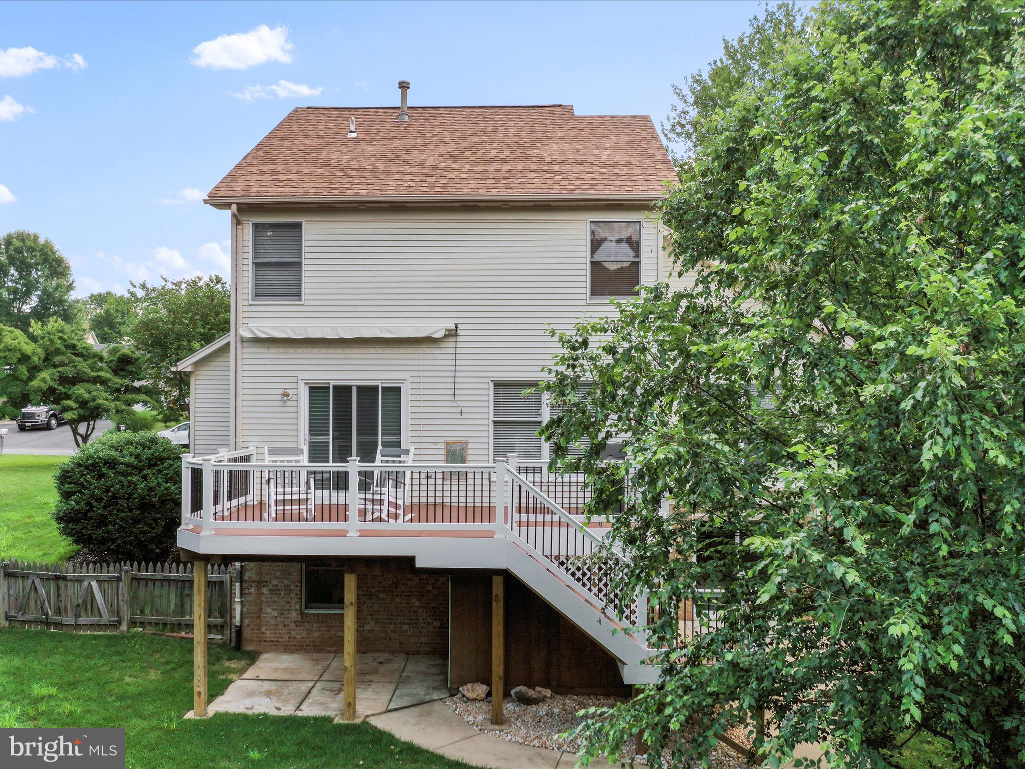 4614 Newington Road Jefferson, MD 21755 - Photo 29 of 35 a backyard of a house with table and chairs