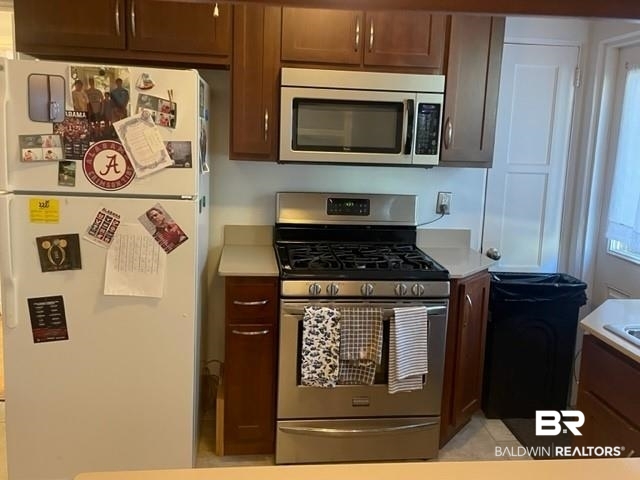 20 Lancaster Road Mobile, AL 36608 - Photo 5 of 13 Kitchen featuring stainless steel appliances and light tile patterned floors