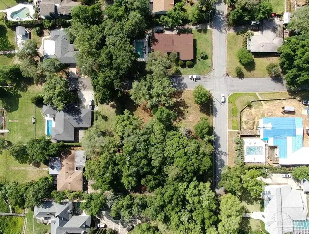 an aerial view of a house with a lake view