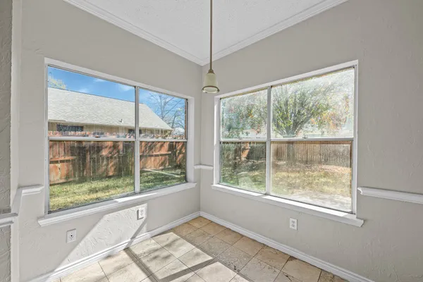 a view of a room that has a large window