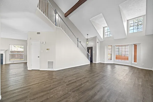 a view of an entryway with wooden floor