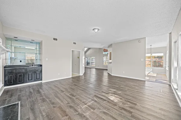 a view of a kitchen cabinets and wooden floor