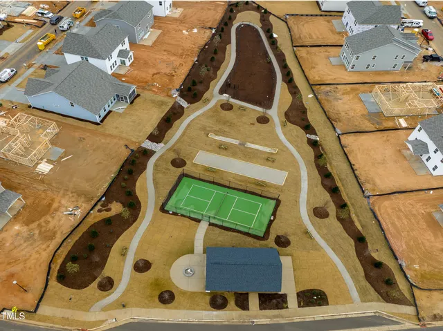 an aerial view of a house with a swimming pool