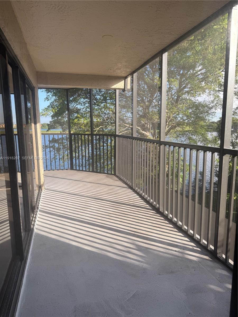 605 Ives Dairy Road, Unit 3067 Miami, FL 33179 - Photo 11 of 28 a view of a balcony with wooden floor
