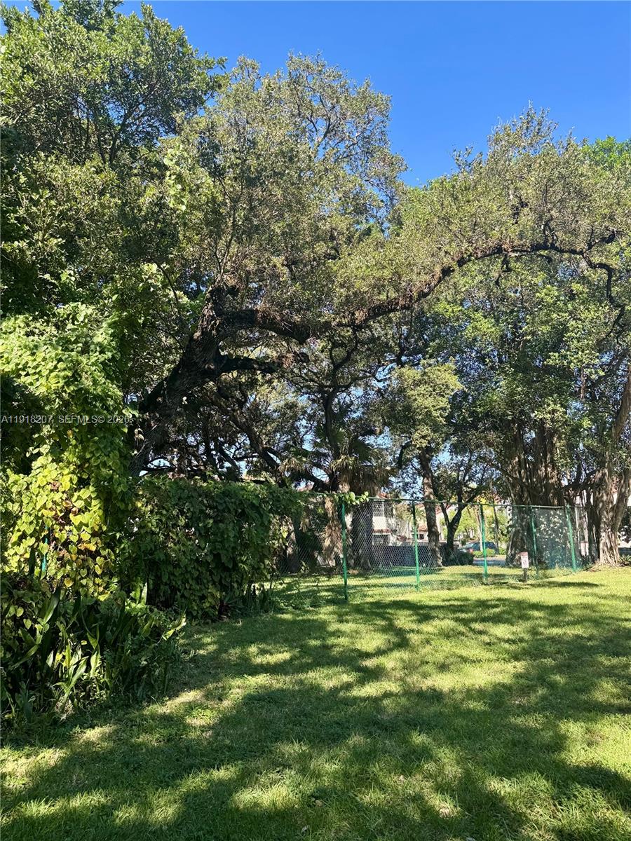 605 Ives Dairy Road, Unit 3067 Miami, FL 33179 - Photo 21 of 28 a big yard with lots of green space