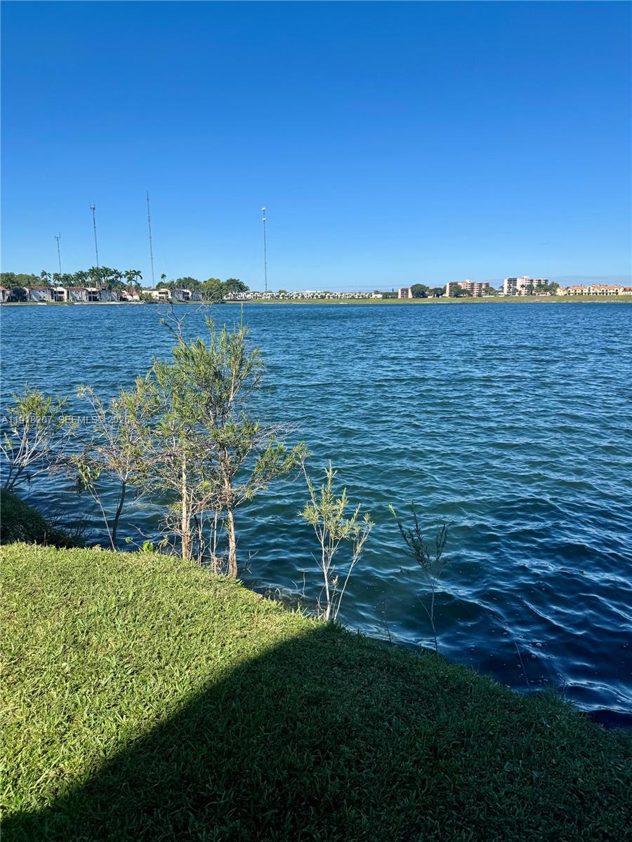 605 Ives Dairy Road, Unit 3067 Miami, FL 33179 - Photo 22 of 28 a view of a lake with a city