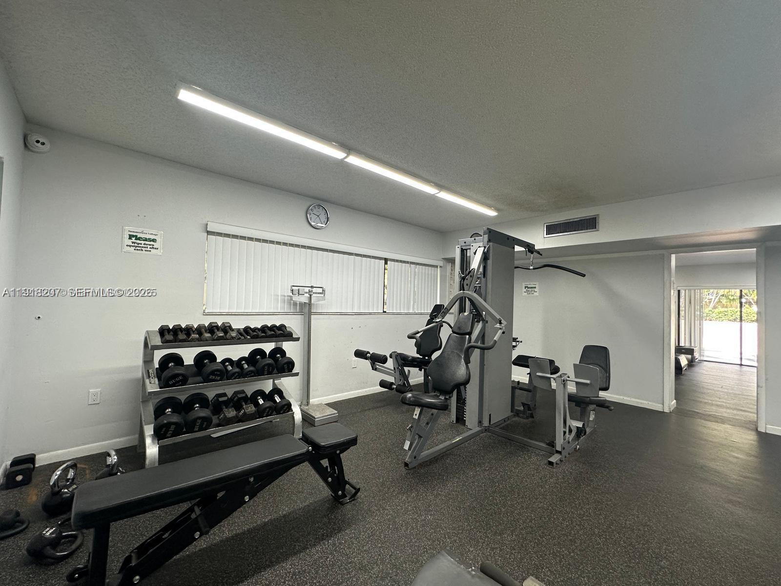 605 Ives Dairy Road, Unit 3067 Miami, FL 33179 - Photo 24 of 28 a view of a room with gym equipment