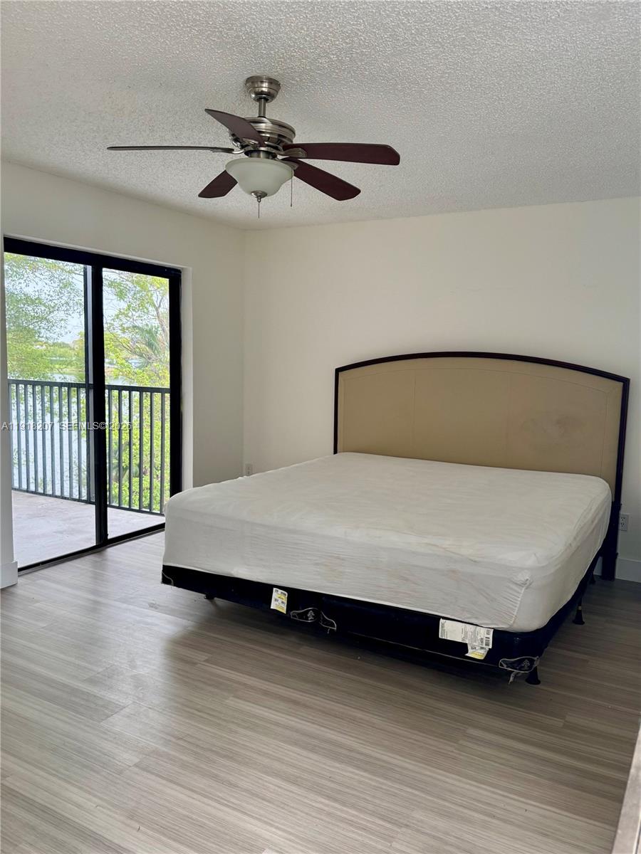 605 Ives Dairy Road, Unit 3067 Miami, FL 33179 - Photo 9 of 28 a bed sitting in a bedroom next to a window