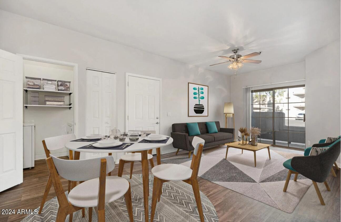 9259 East Raintree Drive, Unit 1 Scottsdale, AZ 85260 - Photo 2 of 15 a dining room with furniture a rug and a chandelier