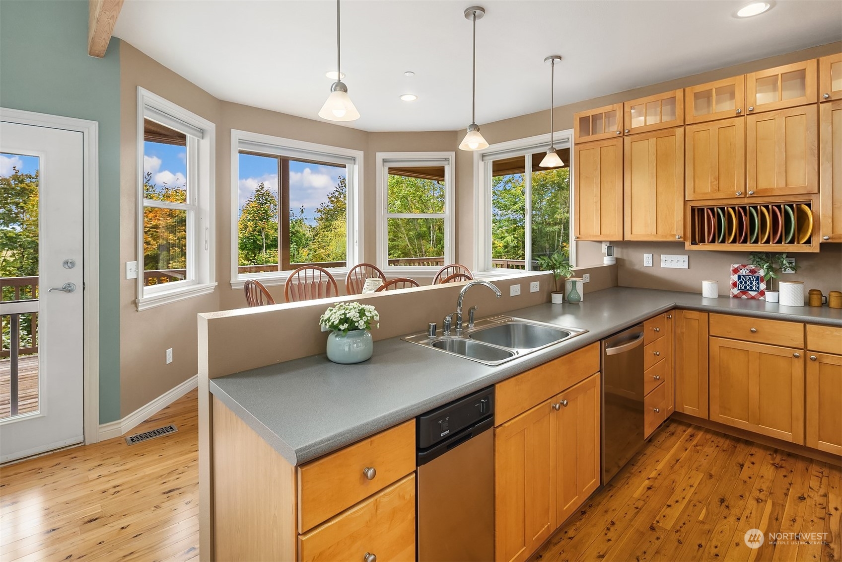 32255 Northeast 88th Street Carnation, WA 98014 - Photo 11 of 40 a kitchen with stainless steel appliances granite countertop sink stove and wooden cabinets