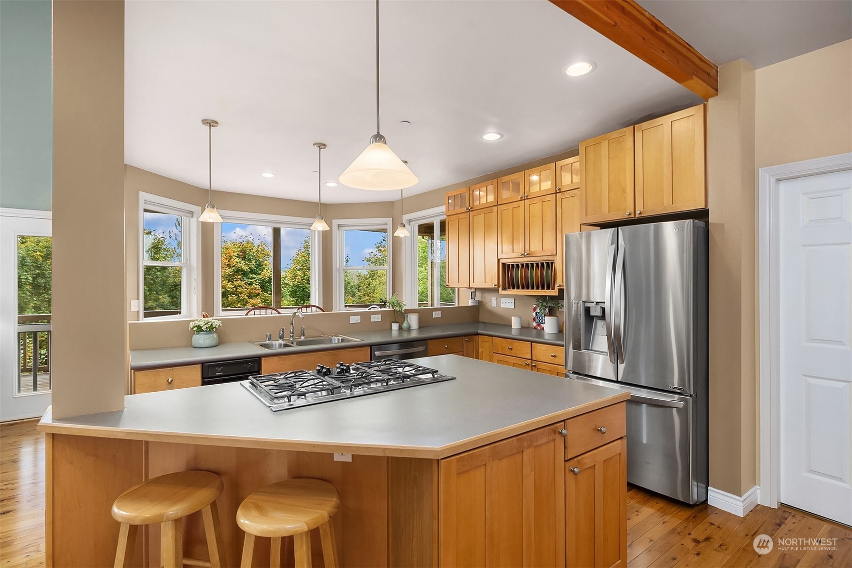 32255 Northeast 88th Street Carnation, WA 98014 - Photo 12 of 40 a kitchen with a stove a refrigerator and a table