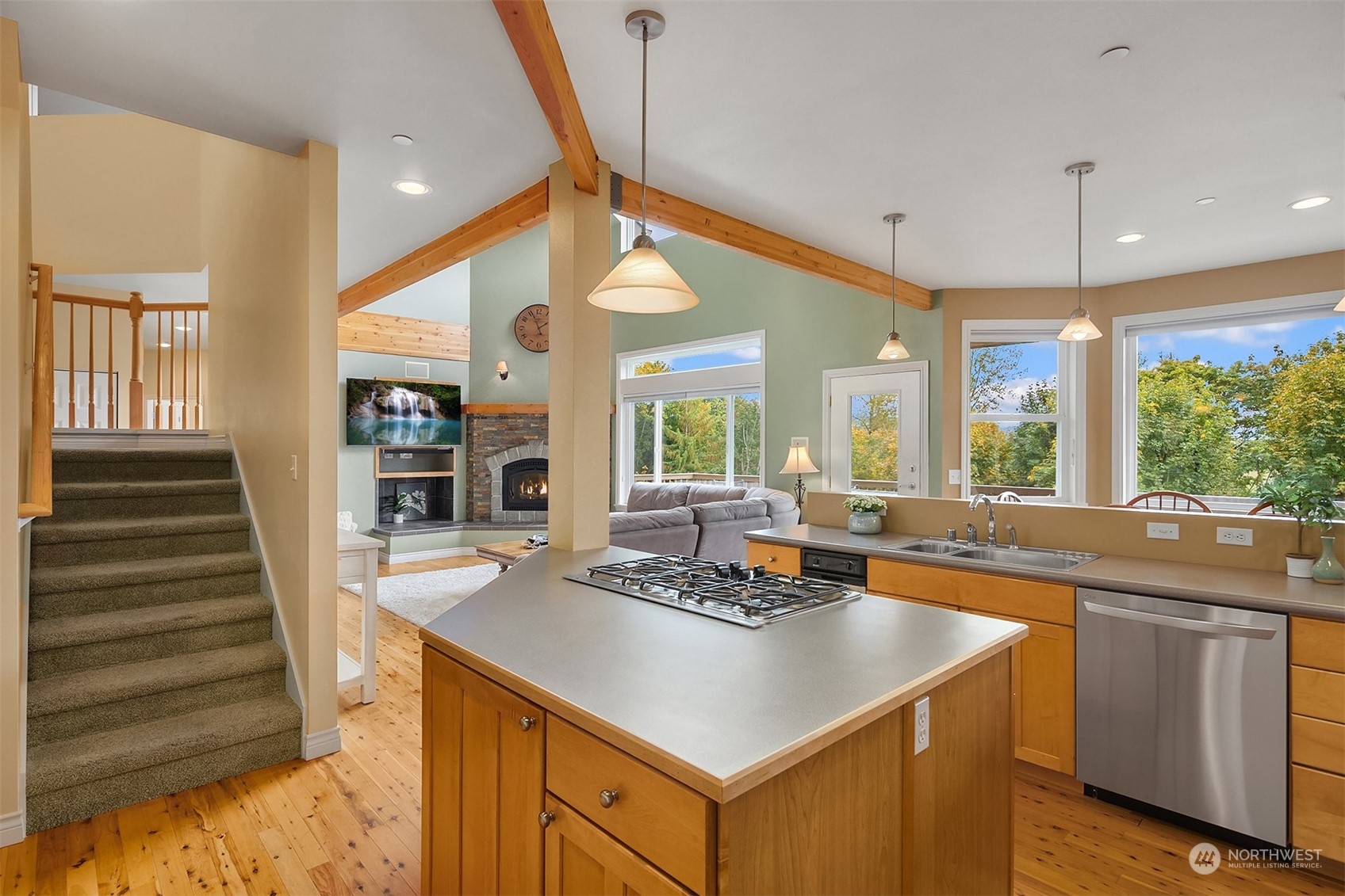32255 Northeast 88th Street Carnation, WA 98014 - Photo 13 of 40 a kitchen with a sink a counter top space and living room view