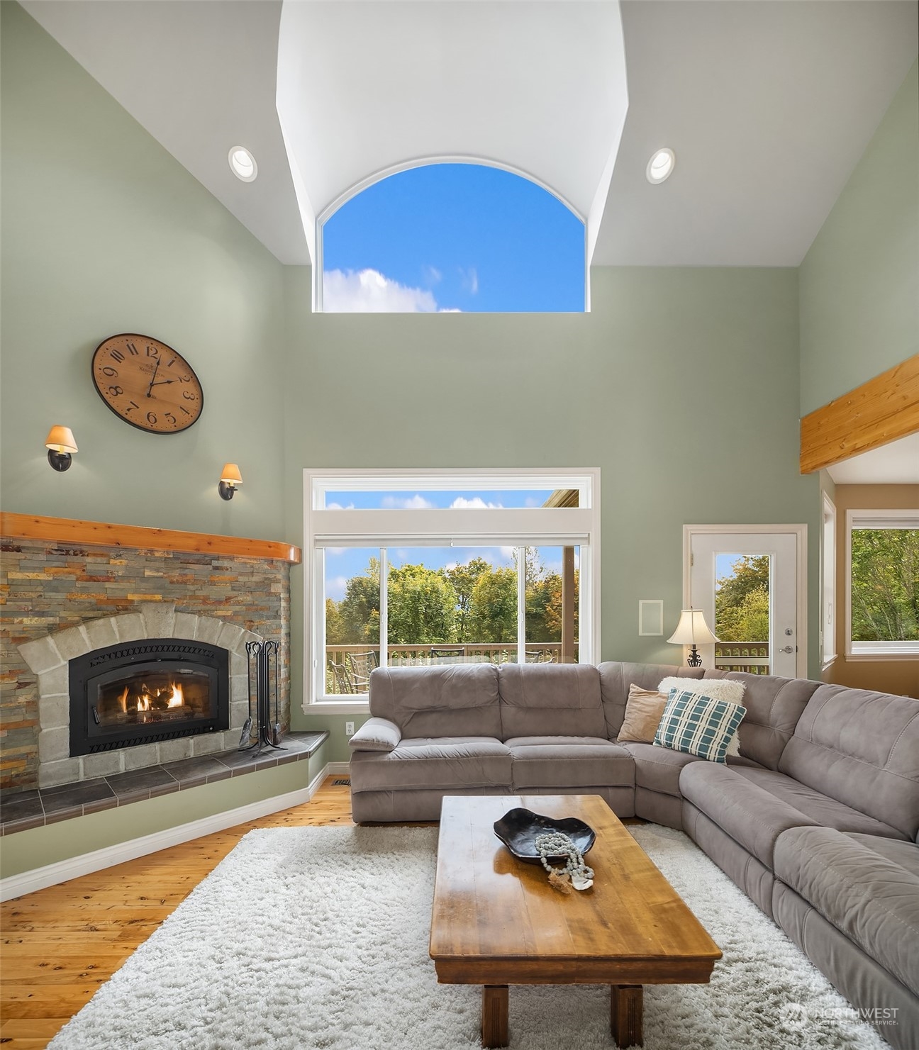 32255 Northeast 88th Street Carnation, WA 98014 - Photo 14 of 40 a living room with furniture and a fireplace