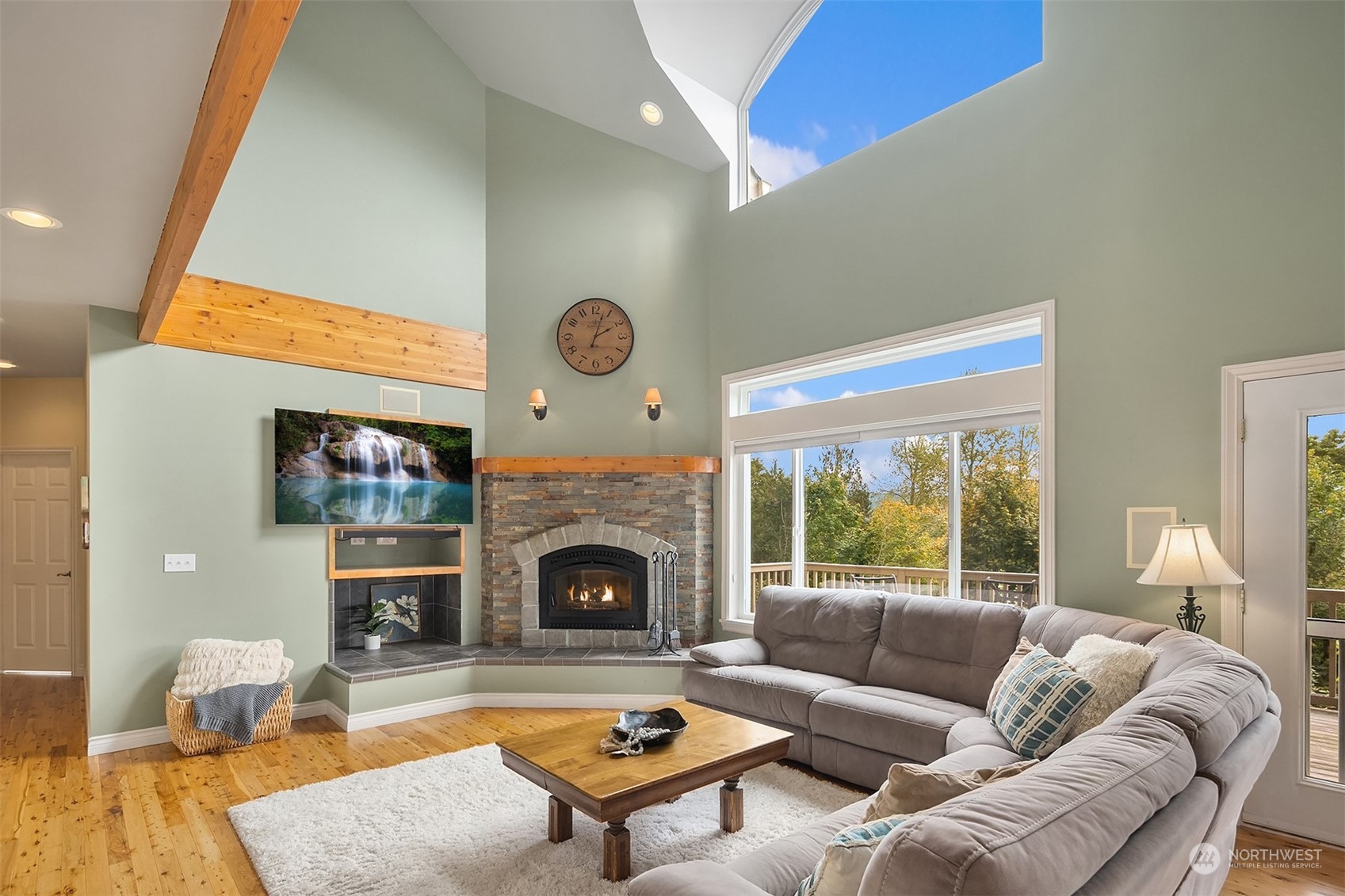 32255 Northeast 88th Street Carnation, WA 98014 - Photo 15 of 40 a living room with furniture and a fireplace