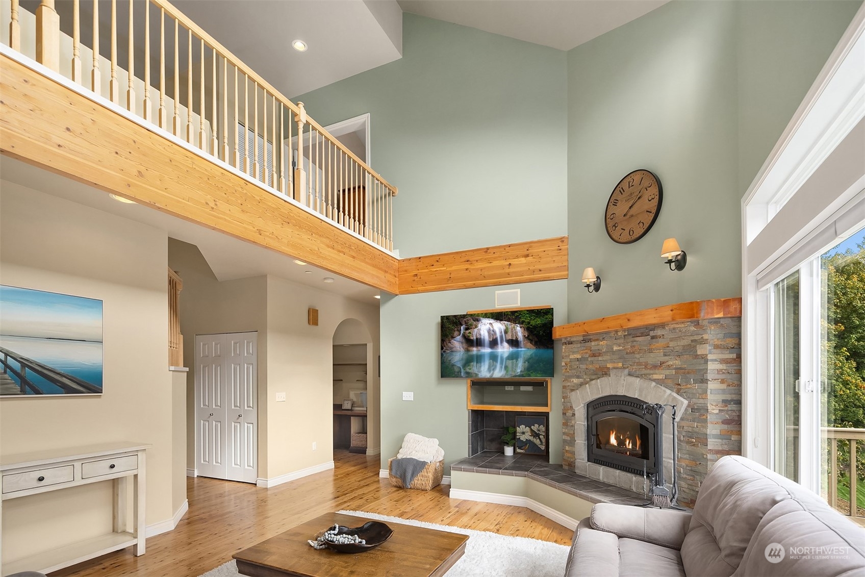 32255 Northeast 88th Street Carnation, WA 98014 - Photo 17 of 40 a living room with furniture and a fireplace