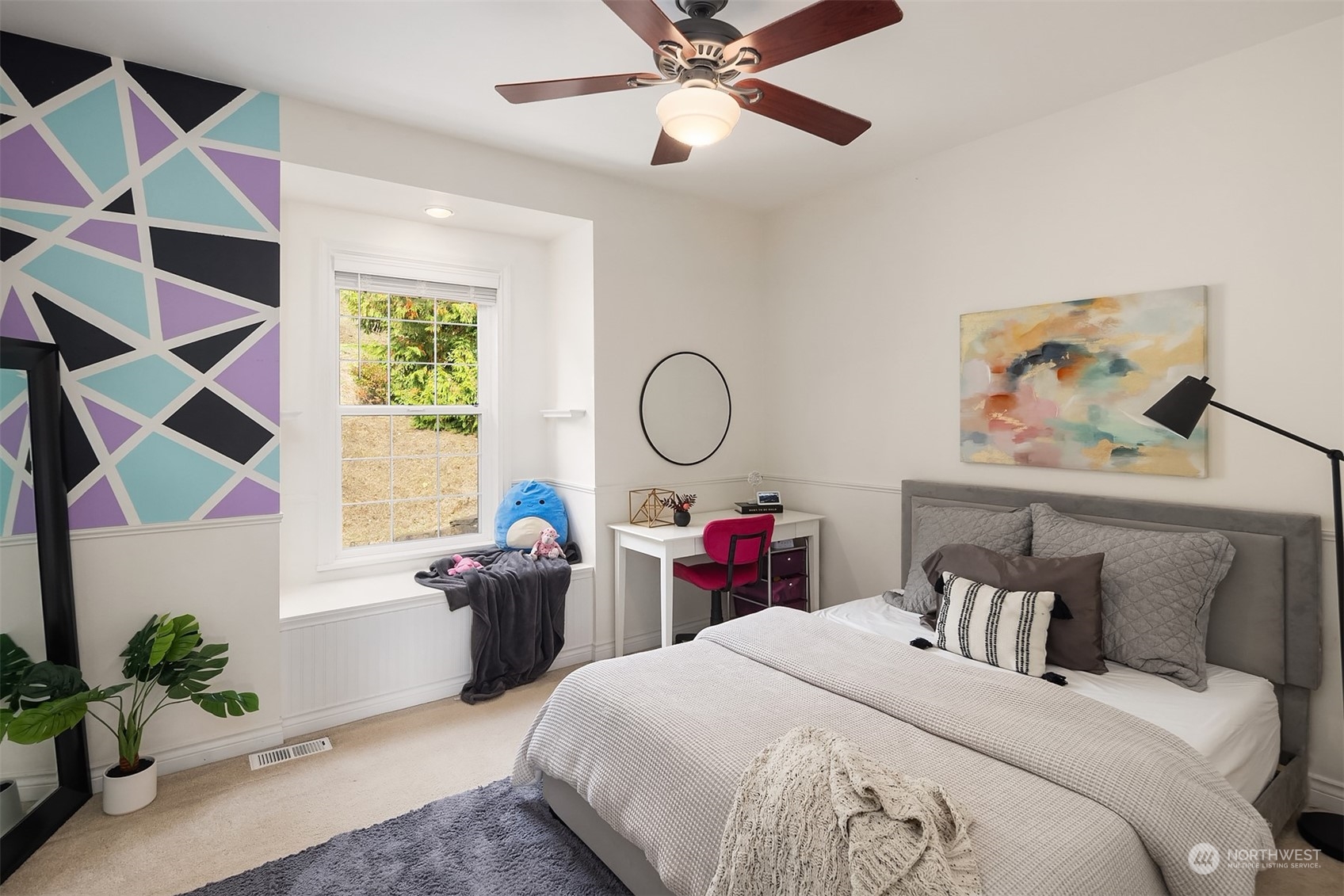 32255 Northeast 88th Street Carnation, WA 98014 - Photo 20 of 40 a bed room with a bed and a chandelier