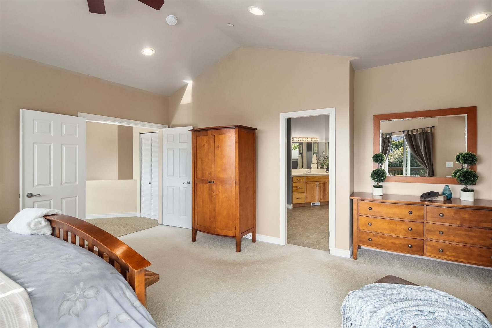 32255 Northeast 88th Street Carnation, WA 98014 - Photo 24 of 40 a bedroom with a bed and a large mirror