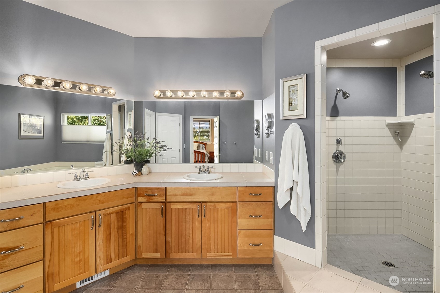 32255 Northeast 88th Street Carnation, WA 98014 - Photo 28 of 40 a spacious bathroom with a granite countertop sink mirror and shower