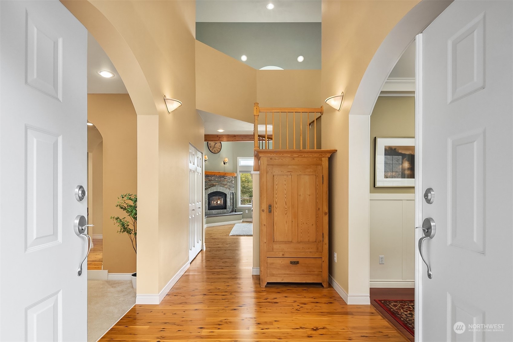 32255 Northeast 88th Street Carnation, WA 98014 - Photo 3 of 40 a view of a hallway with wooden floor and staircase