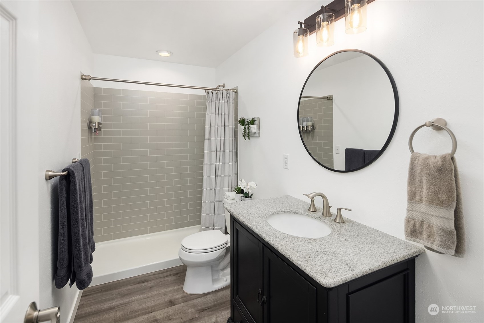 32255 Northeast 88th Street Carnation, WA 98014 - Photo 32 of 40 a bathroom with a granite countertop sink toilet and a mirror