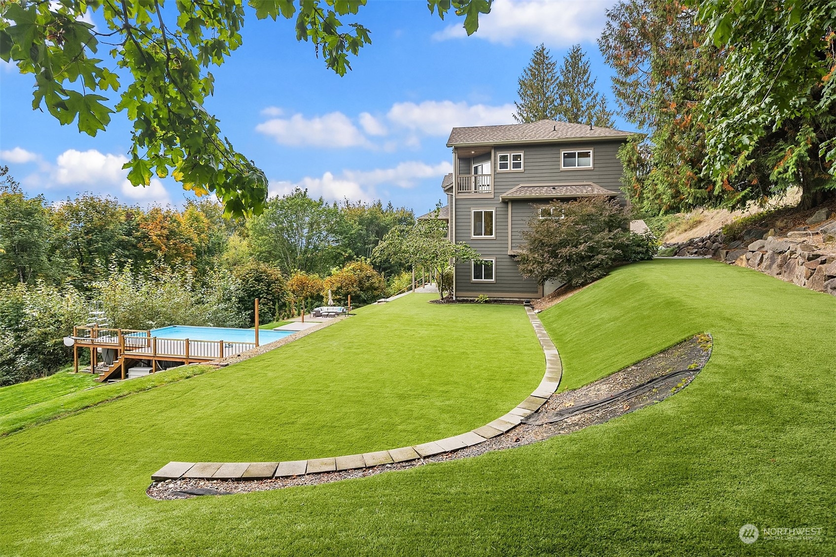 32255 Northeast 88th Street Carnation, WA 98014 - Photo 39 of 40 a view of a white house with a big yard and a large tree