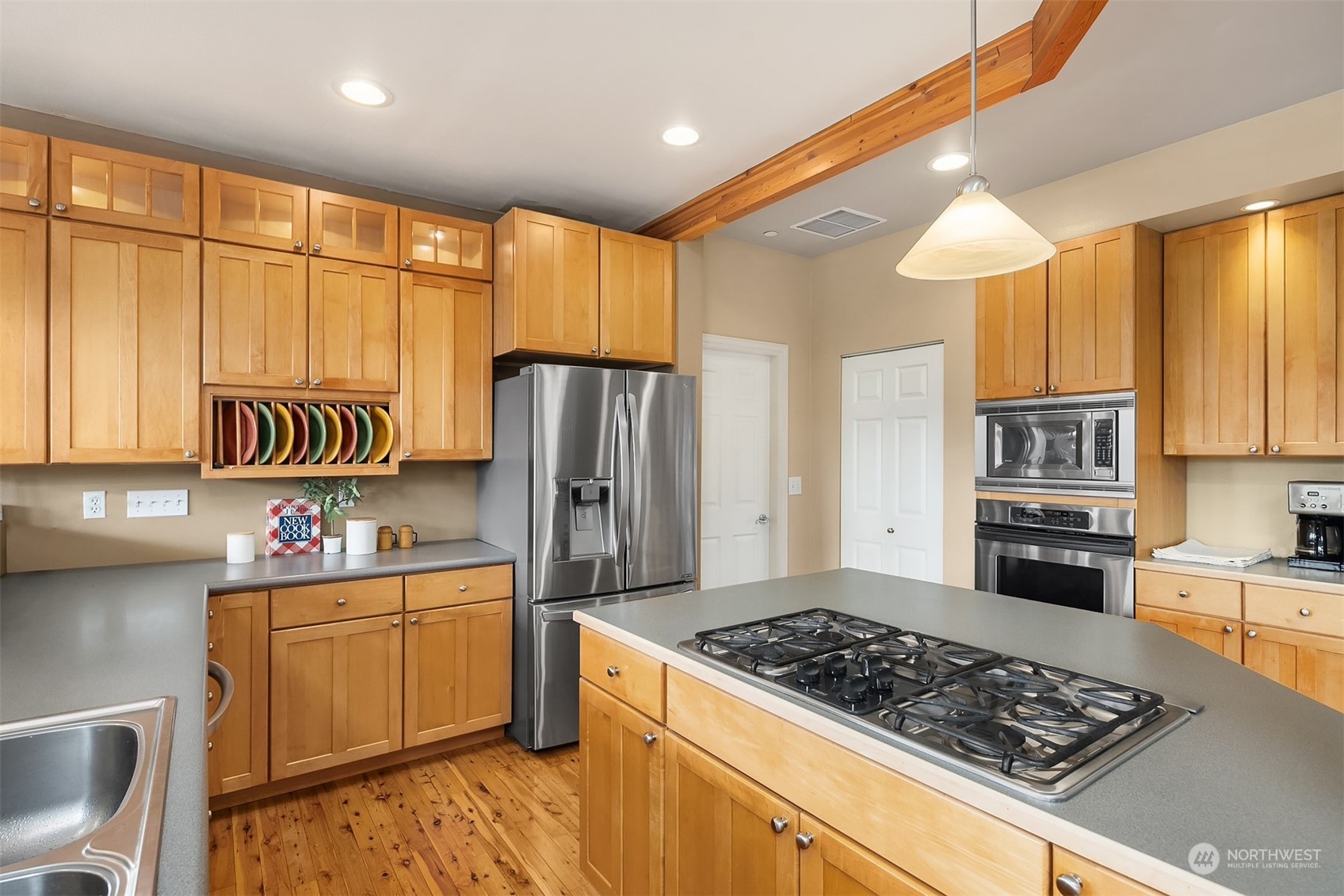 32255 Northeast 88th Street Carnation, WA 98014 - Photo 10 of 40 a kitchen with a stove a refrigerator and a sink