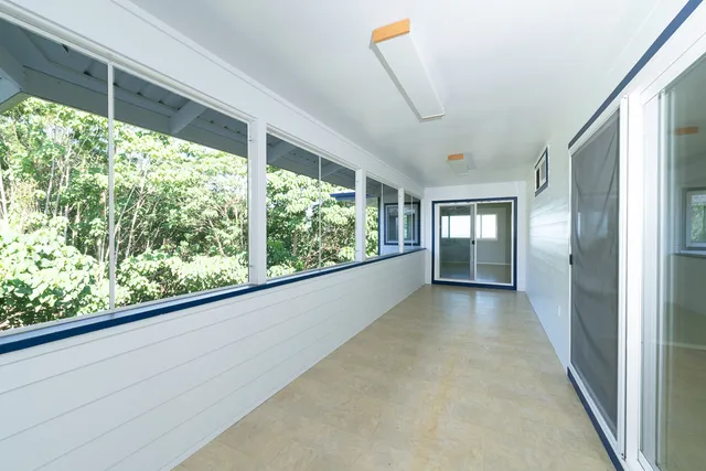 a view of a room with a large window