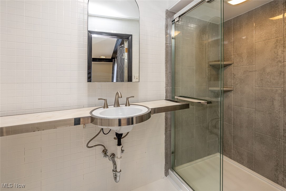 5700 Brookside Road Independence, OH 44131 - Photo 19 of 42 Primary bathroom with updated shower.