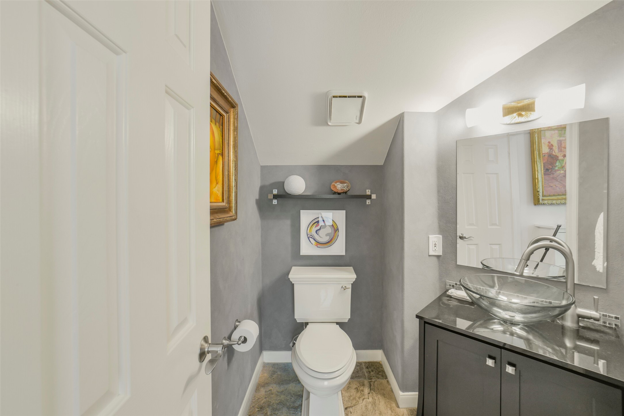 2026 Welch Street Houston, TX 77019 - Photo 12 of 28 Half bathroom on the second level, tucked away from the kitchen