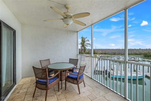 a view of a patio with a table and chairs