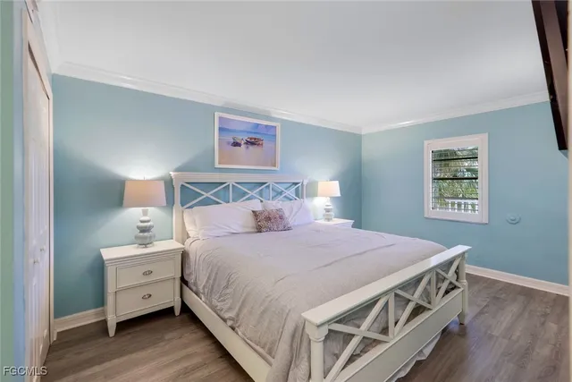 a bedroom with a bed and a night stand