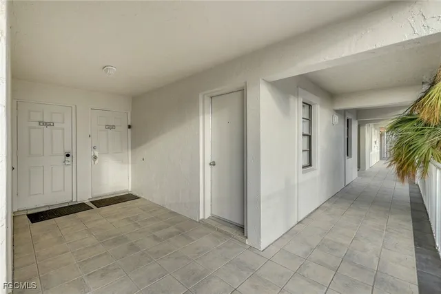a view of a hallway with entryway and closet