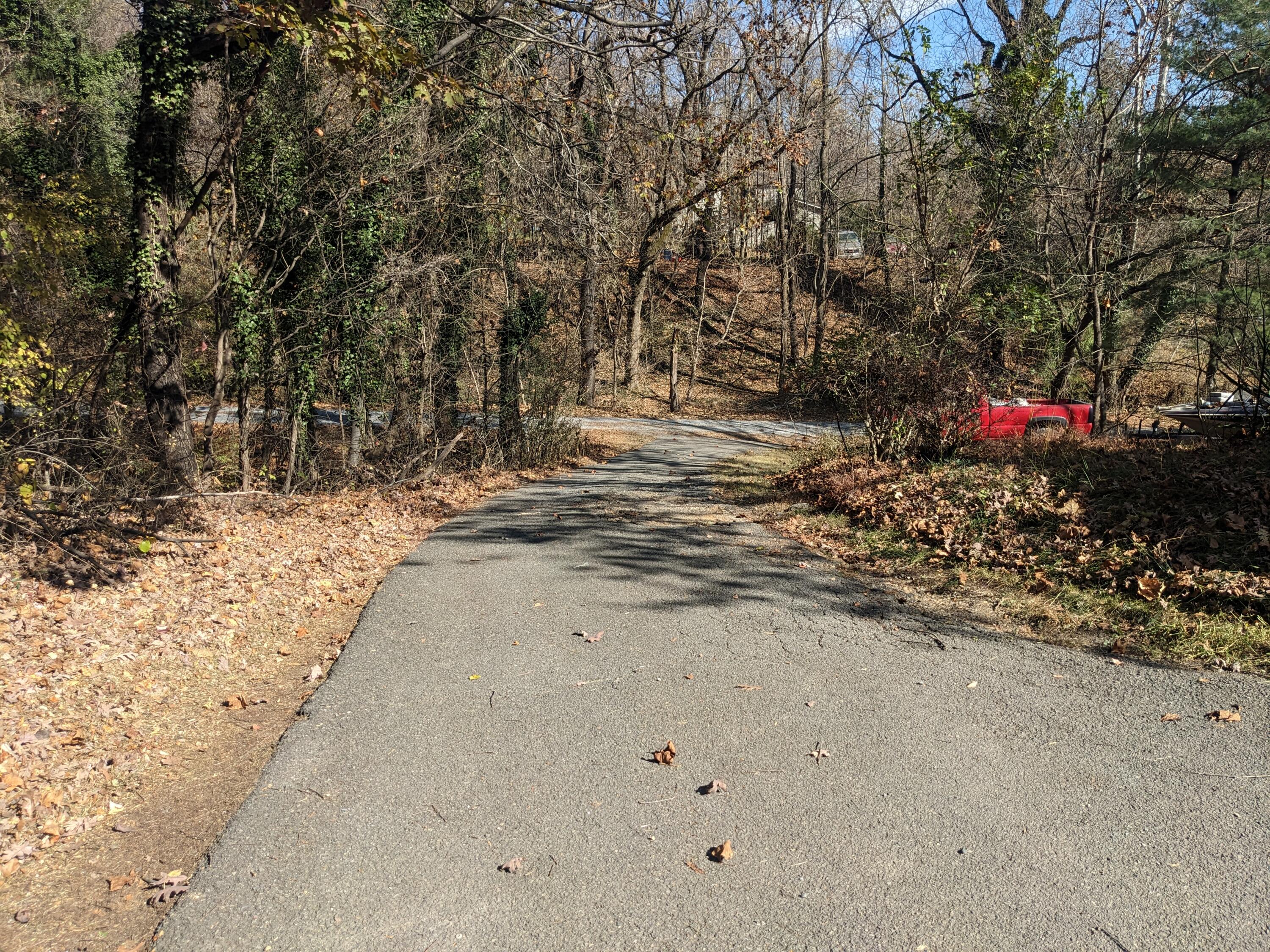 1038-1040 Hogan Road Blue Ridge, VA 24064 - Photo 8 of 22 a view of a road with a yard