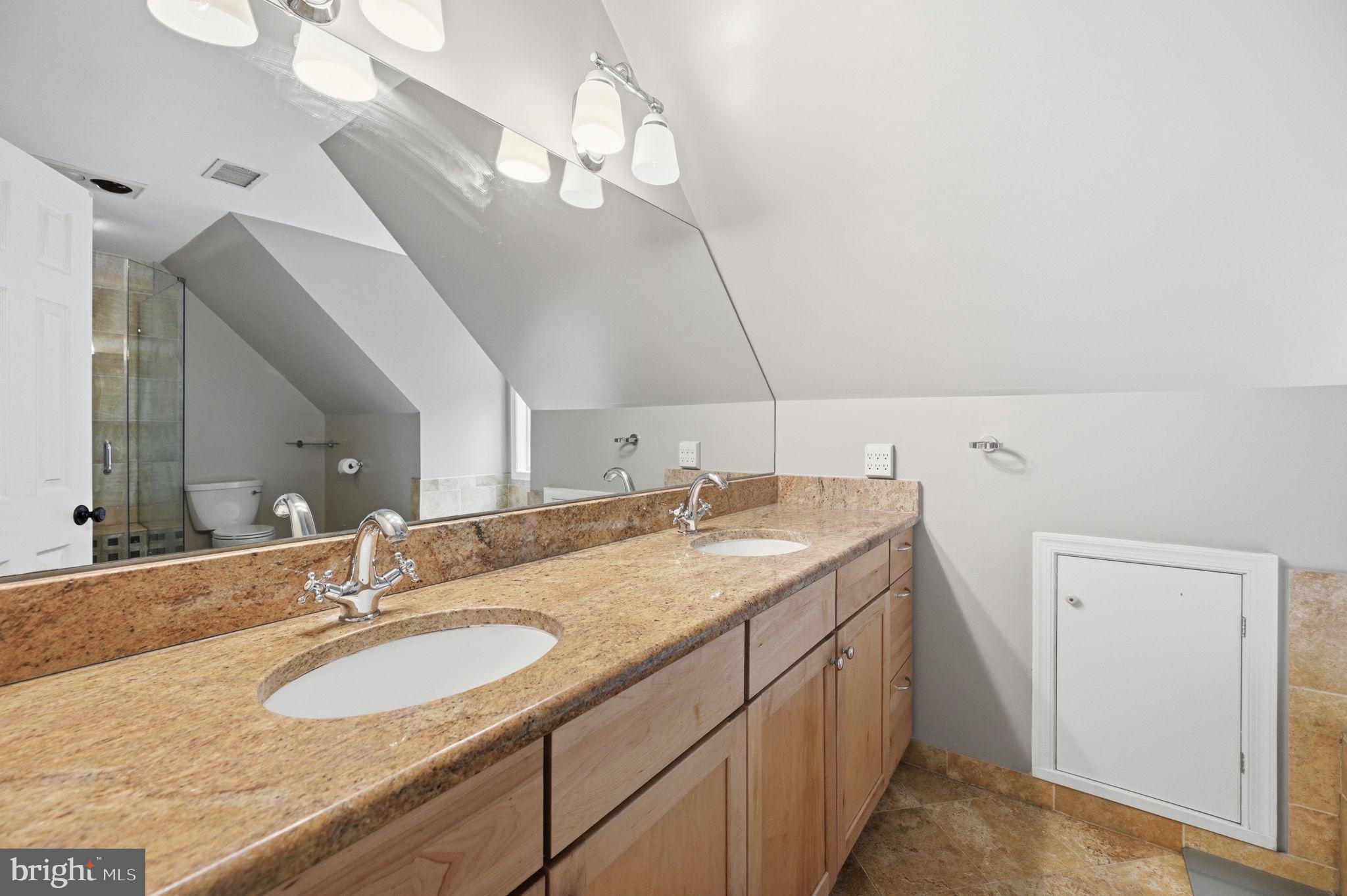2506 Pinoak Lane Reston, VA 20191 - Photo 16 of 33 a bathroom with a granite countertop sink and a mirror
