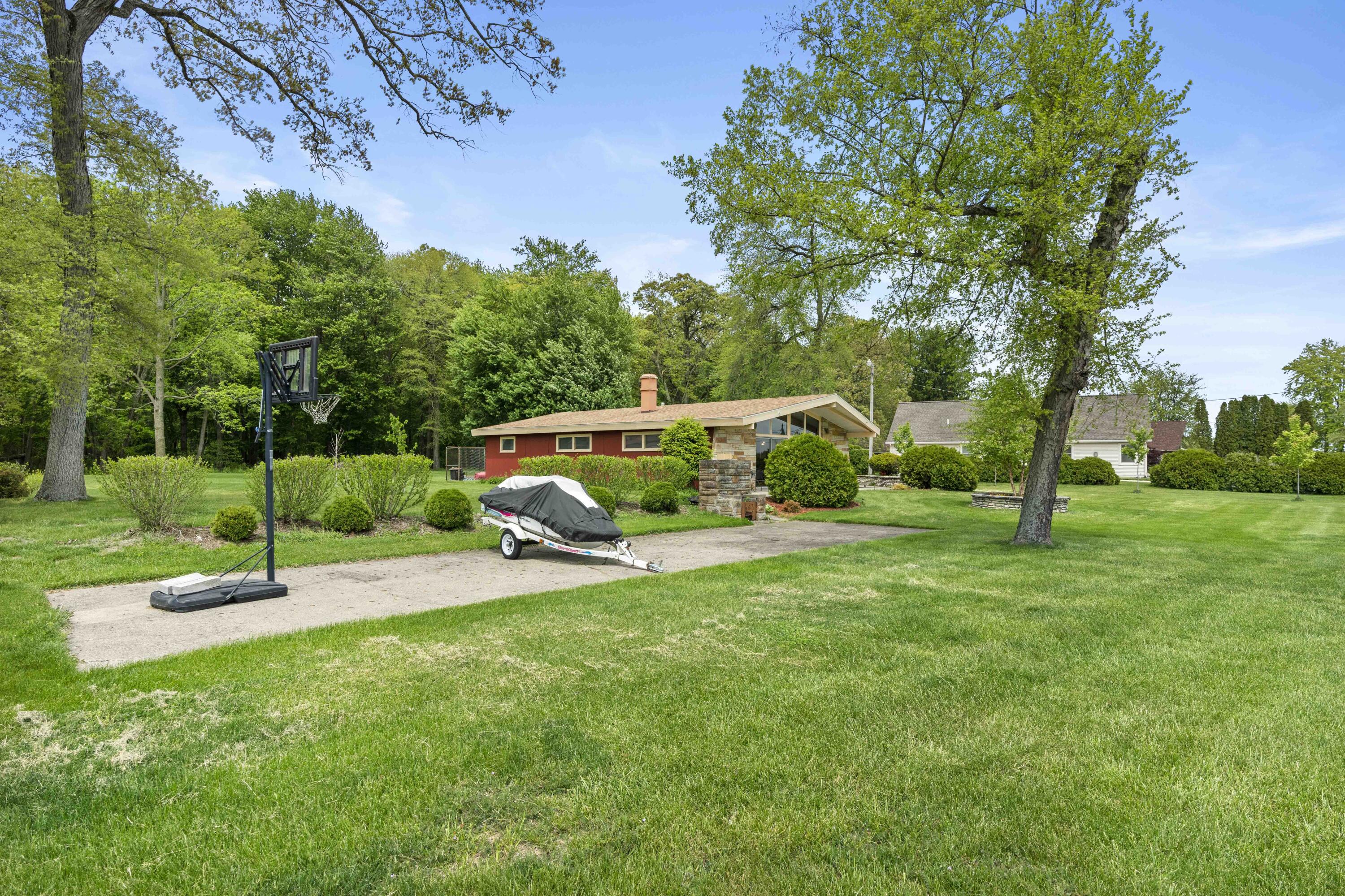 5100 South County Road 210 Knox, IN 46534 - Photo 10 of 14 a view of a park with swings and a table