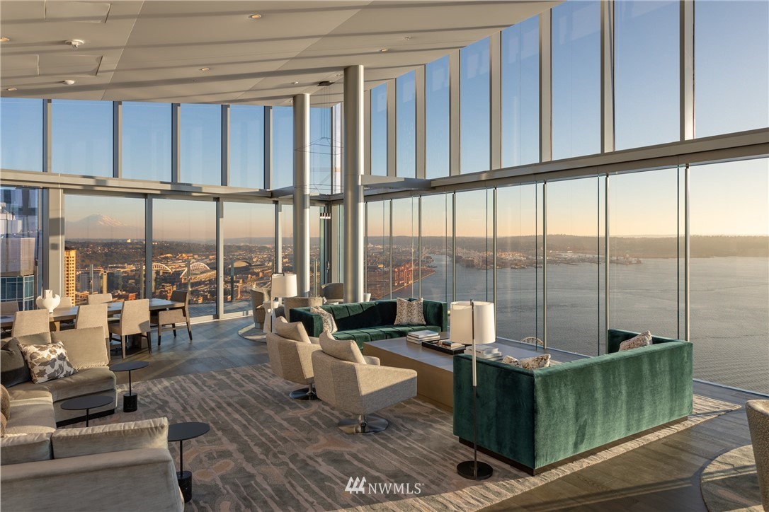 121 Stewart Street, Unit 2201 Seattle, WA 98101 - Photo 16 of 23 a living room with furniture and a large window