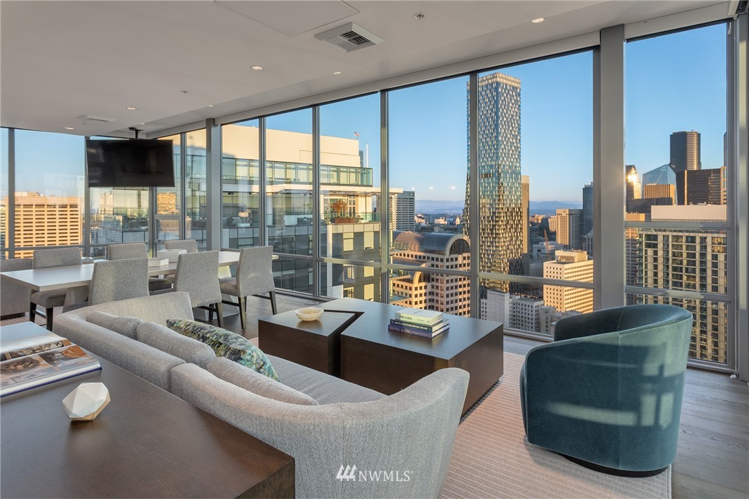 121 Stewart Street, Unit 2201 Seattle, WA 98101 - Photo 20 of 23 a living room with furniture and large windows