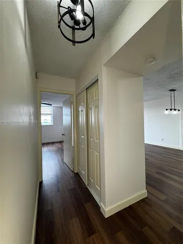 a view of gallery with wooden floor